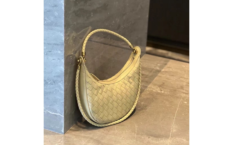 Woven crescent - shaped bag