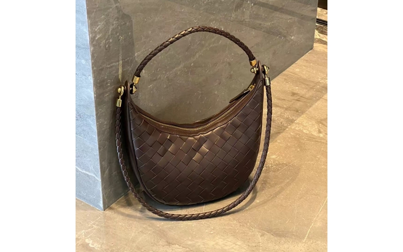 Woven crescent - shaped bag