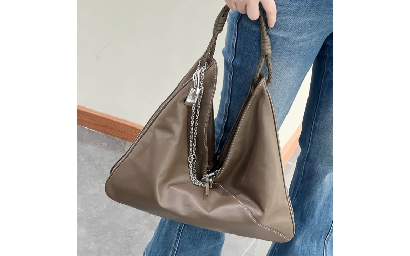 Vegetable - tanned sheepskin under - arm bag